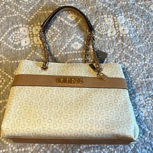 Guess shoulder bag. White and cream with gold metal detailing.